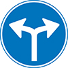 blauw rond verkeersbord met 2 witte pijlen